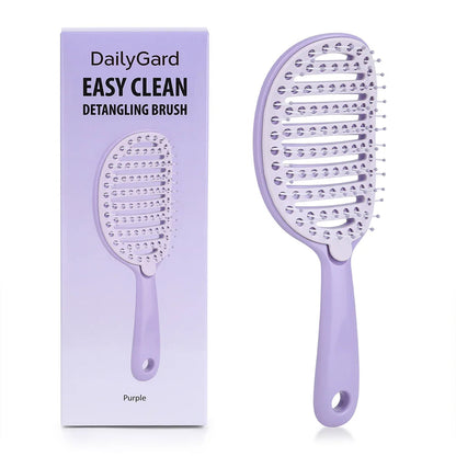 GlowBrush Clean – purple detangling brush beside its retail box | Glow Vanta